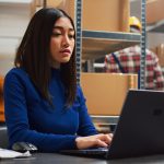 Female entrepreneur working on supply chain development